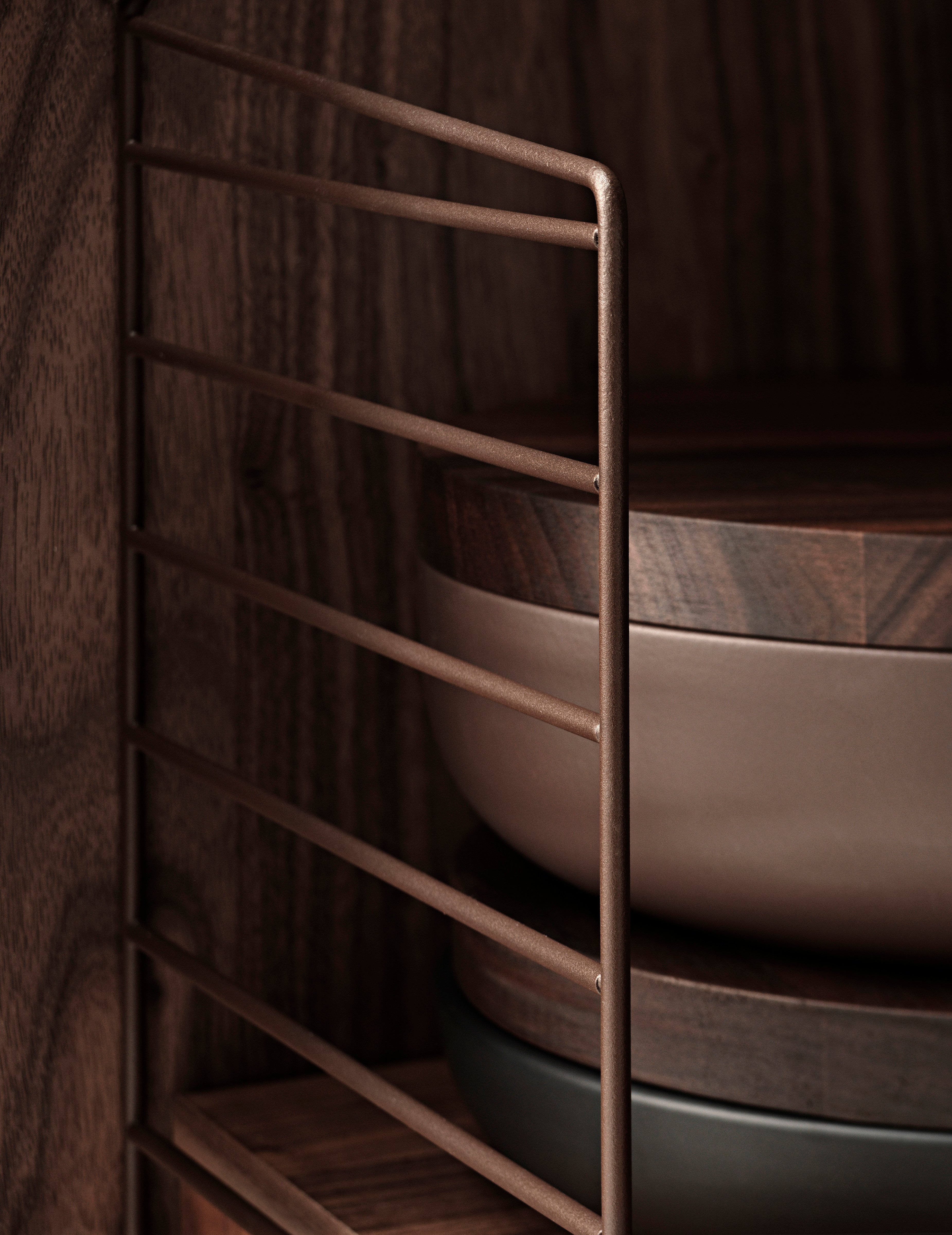 Close up on String Furniture's panels in brown.