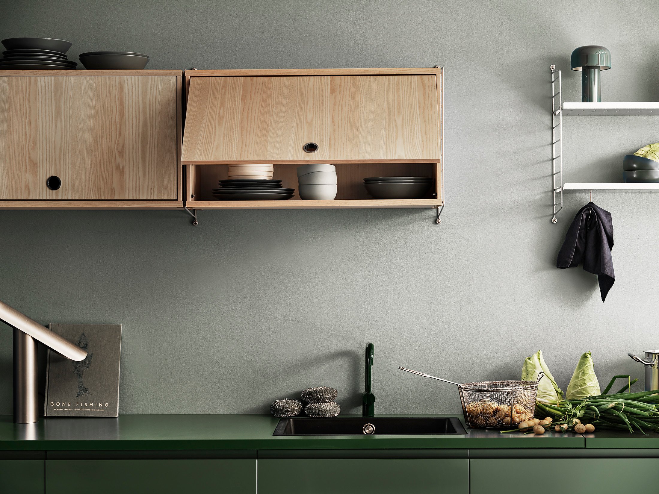 Add a cabinet with flip door for smart kitchen storage. The door opens towards the ceiling to avoid being in your way while cooking.
