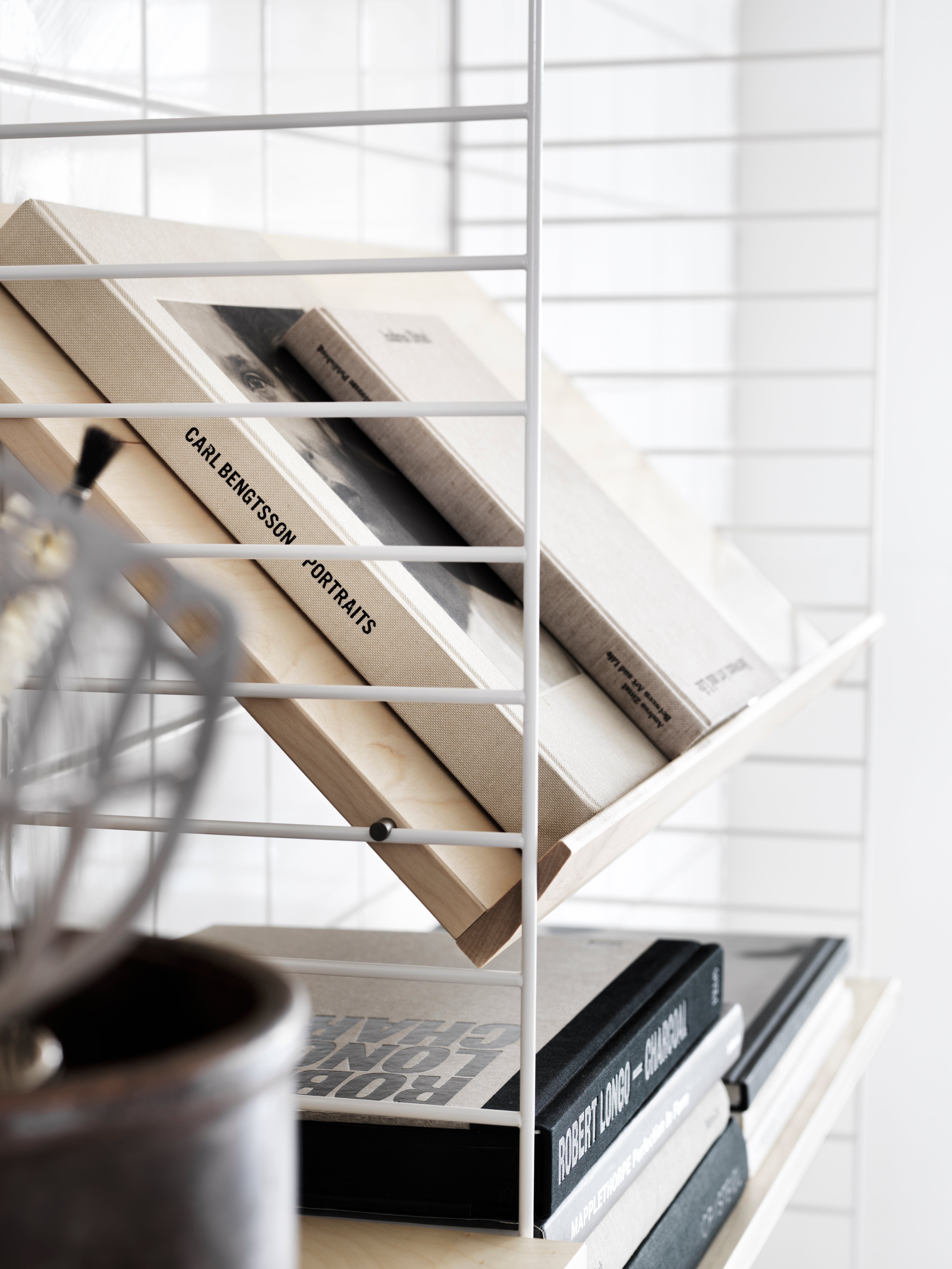 wall panels in white. magazine shelf solid in ash.