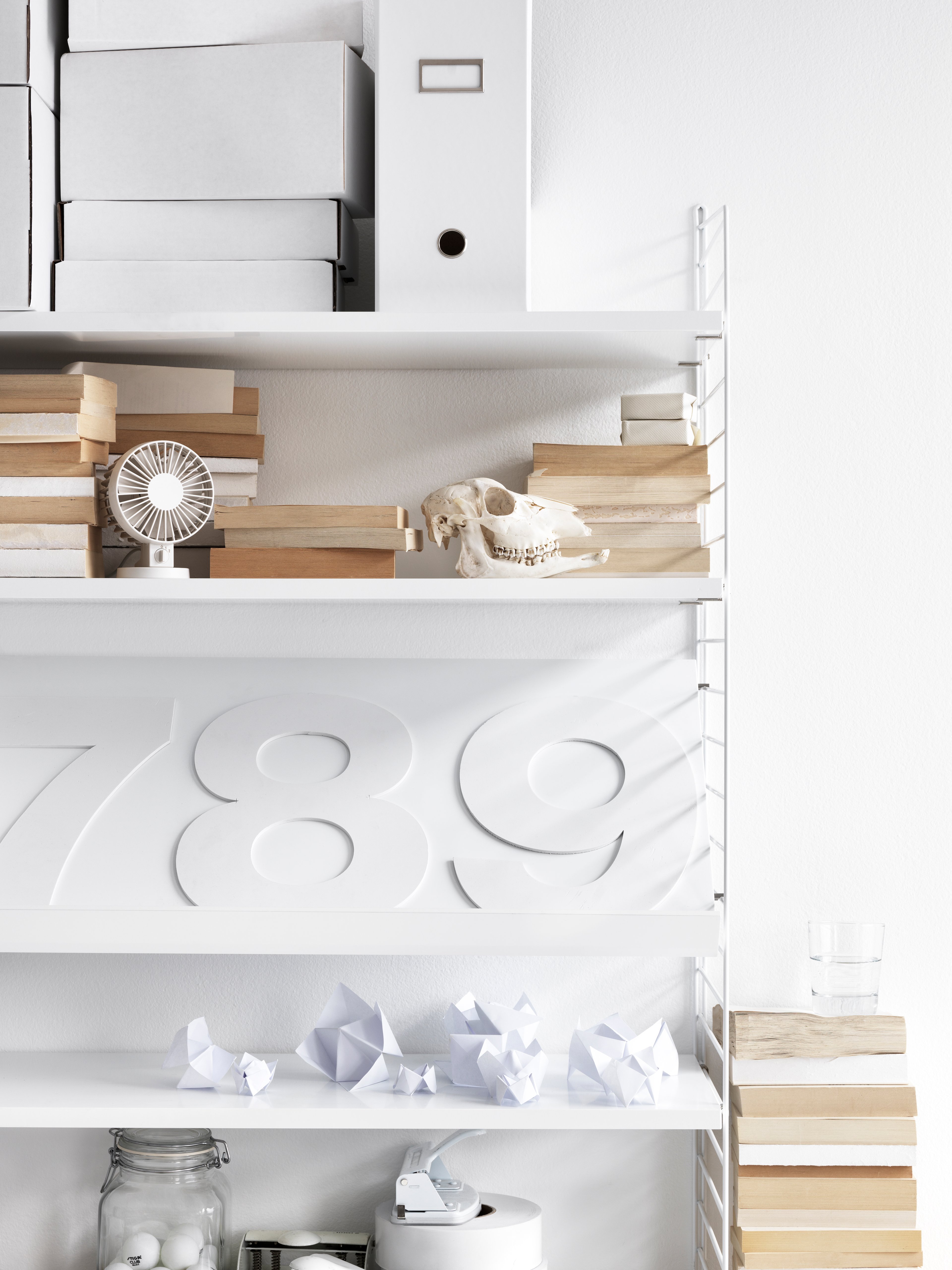 wall panels, shelves and magazine shelf solid in white.